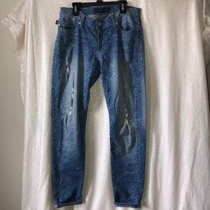 Mid-rise, distressed skinny jeans